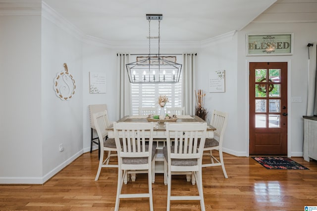 325 Driving Range Rd, Cropwell, AL 35054 - dining space with a chandelier, light wood-style flooring, crown molding, and baseboards