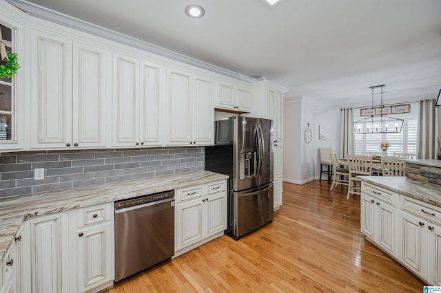 325 Driving Range Rd, Cropwell, AL 35054 - kitchen with appliances with stainless steel finishes, light wood-style flooring, decorative backsplash, baseboards, and white cabinetry