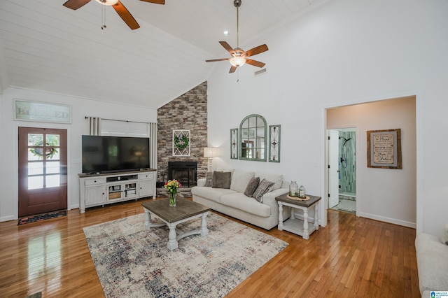 325 Driving Range Rd, Cropwell, AL 35054 - living area with ceiling fan, high vaulted ceiling, wood finished floors, a stone fireplace, and baseboards