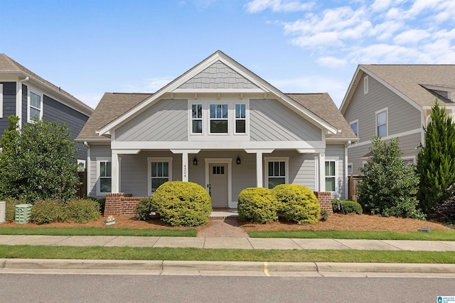 4304 Cahaba Bnd, Trussville, AL 35173 - view of front facade featuring brick siding, covered porch, and roof with shingles