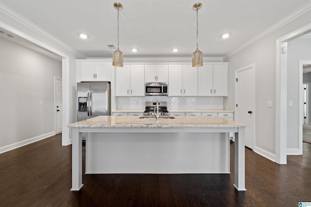 4304 Cahaba Bnd, Trussville, AL 35173 - kitchen with appliances with stainless steel finishes, a center island with sink, decorative backsplash, white cabinets, and ornamental molding