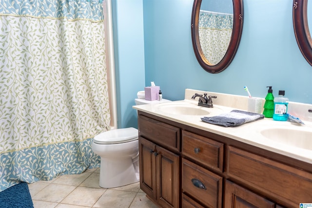 178 Jerry Marsh Rd, Locust Fork, AL 35097 - full bathroom with double vanity, toilet, and tile patterned flooring