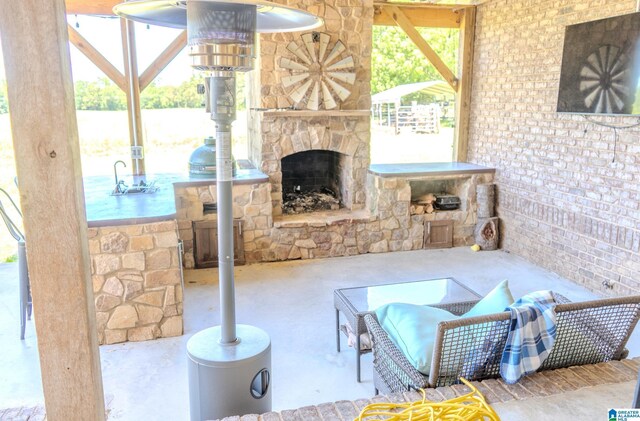 178 Jerry Marsh Rd, Locust Fork, AL 35097 - view of patio / terrace featuring an outdoor stone fireplace and an outdoor kitchen