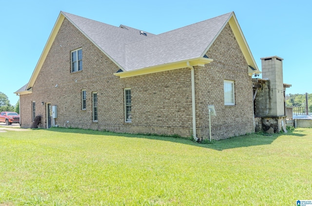 178 Jerry Marsh Rd, Locust Fork, AL 35097 - view of side of property featuring a shingled roof, brick siding, and a lawn