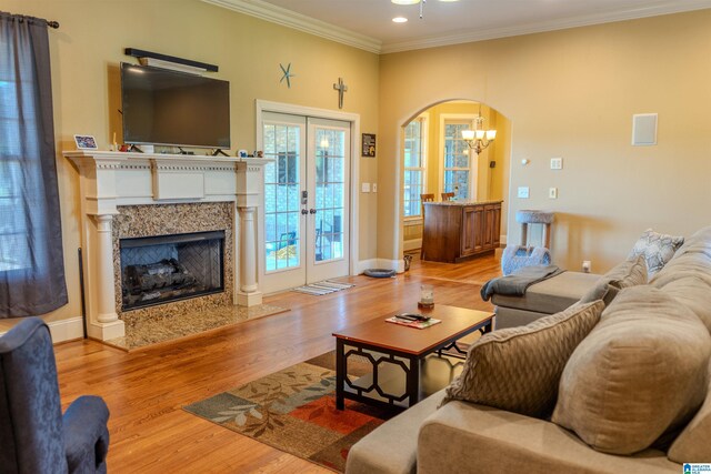 178 Jerry Marsh Rd, Locust Fork, AL 35097 - living area with arched walkways, ornamental molding, light wood-style floors, a chandelier, and recessed lighting
