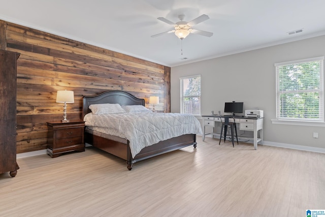 5182 Park Side Cir, Hoover, AL 35244 - bedroom featuring ornamental molding, light wood-style flooring, wooden walls, a ceiling fan, and a desk