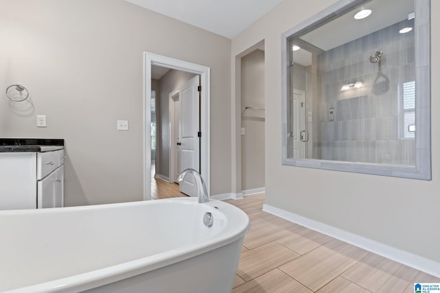 5182 Park Side Cir, Hoover, AL 35244 - bathroom with a freestanding bath, a tile shower, and vanity