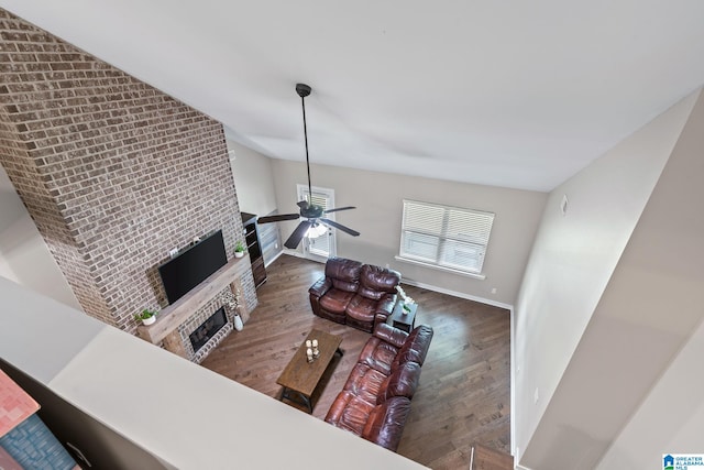5182 Park Side Cir, Hoover, AL 35244 - living room with a fireplace, wood finished floors, ceiling fan, and vaulted ceiling