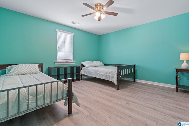 5182 Park Side Cir, Hoover, AL 35244 - bedroom with wood finished floors and a ceiling fan