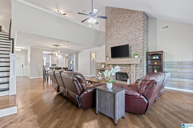 5182 Park Side Cir, Hoover, AL 35244 - living area with stairway, high vaulted ceiling, ceiling fan, wood finished floors, and a brick fireplace