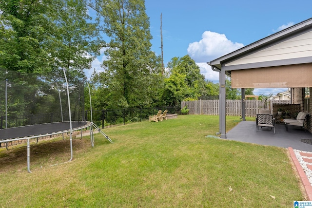5182 Park Side Cir, Hoover, AL 35244 - fenced backyard featuring a trampoline and a patio area