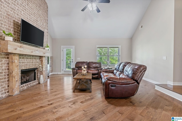 5182 Park Side Cir, Hoover, AL 35244 - living area with high vaulted ceiling, wood finished floors, ceiling fan, and a fireplace