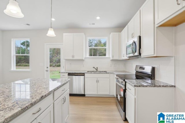 2029 Valley Run, Leeds, AL 35094 - kitchen with stainless steel appliances, healthy amount of natural light, tasteful backsplash, light stone counters, and recessed lighting