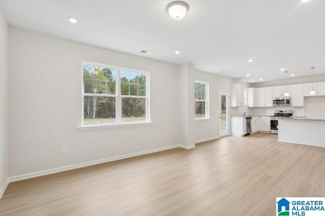 2029 Valley Run, Leeds, AL 35094 - unfurnished living room with light wood-style floors, baseboards, and recessed lighting