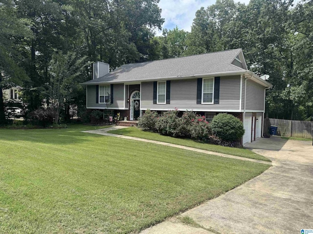 118 Dogwood Trl, Alabaster, AL 35007 - bi-level home featuring concrete driveway, a chimney, an attached garage, and brick siding