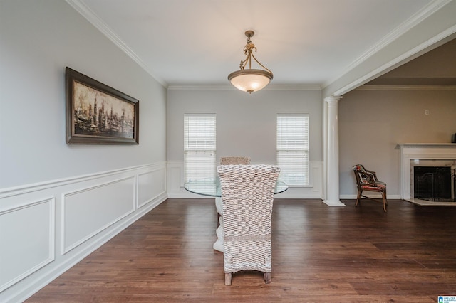 1166 Eagle Dr, Maylene, AL 35114 - dining space with ornamental molding, ornate columns, dark wood-type flooring, a wainscoted wall, and a fireplace