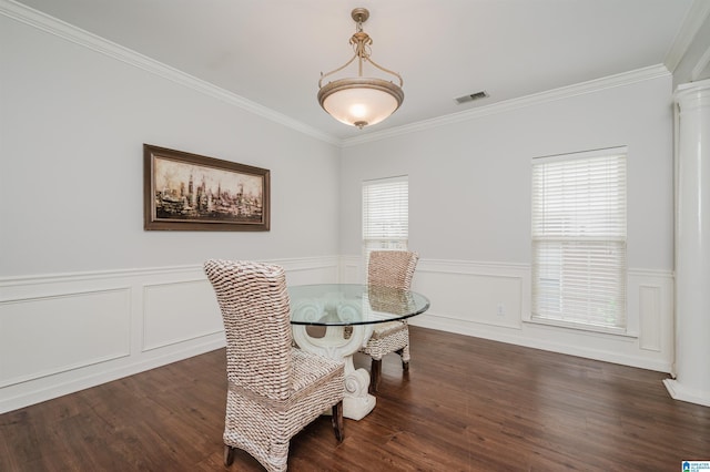 1166 Eagle Dr, Maylene, AL 35114 - dining space with crown molding, wainscoting, dark wood-style floors, ornate columns, and a decorative wall