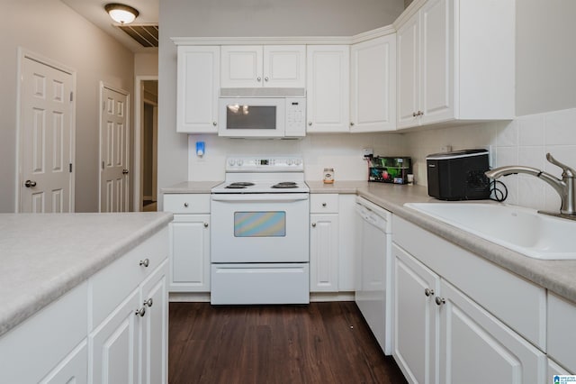 1166 Eagle Dr, Maylene, AL 35114 - kitchen with white appliances, dark wood-style flooring, white cabinets, and light countertops