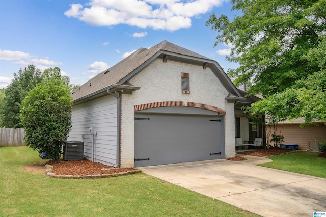 1166 Eagle Dr, Maylene, AL 35114 - view of side of property with concrete driveway, an attached garage, and roof with shingles