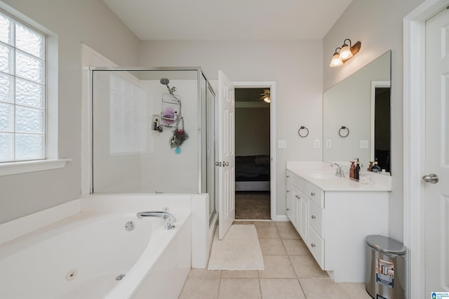 1166 Eagle Dr, Maylene, AL 35114 - bathroom featuring a shower stall, a tub with jets, vanity, tile patterned flooring, and connected bathroom