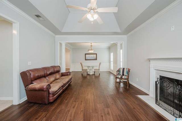 1166 Eagle Dr, Maylene, AL 35114 - living room featuring wood finished floors, decorative columns, a ceiling fan, crown molding, and a fireplace with flush hearth
