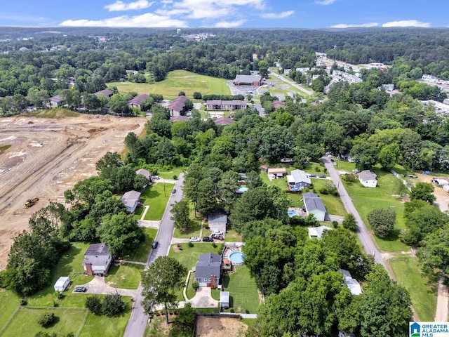 3303 Carousel Dr, Fultondale, AL 35068 - aerial overview of property's location featuring nearby suburban area and a forest