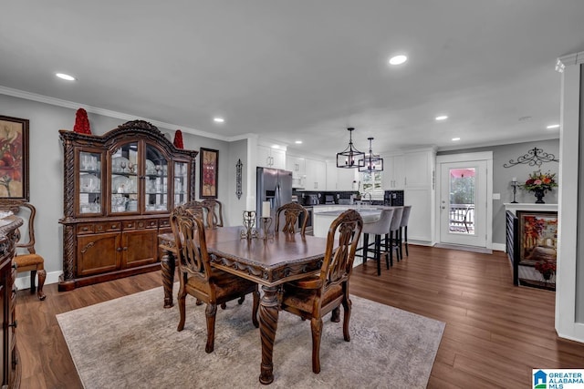 3303 Carousel Dr, Fultondale, AL 35068 - dining area with recessed lighting, ornamental molding, a chandelier, and dark wood-style flooring