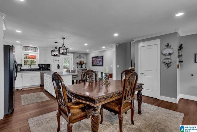 3303 Carousel Dr, Fultondale, AL 35068 - dining room with crown molding, dark wood-style flooring, and recessed lighting