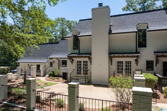 318 Valley View Rd, Indian Springs Village, AL 35124 - back of property featuring french doors, brick siding, a chimney, and entry steps