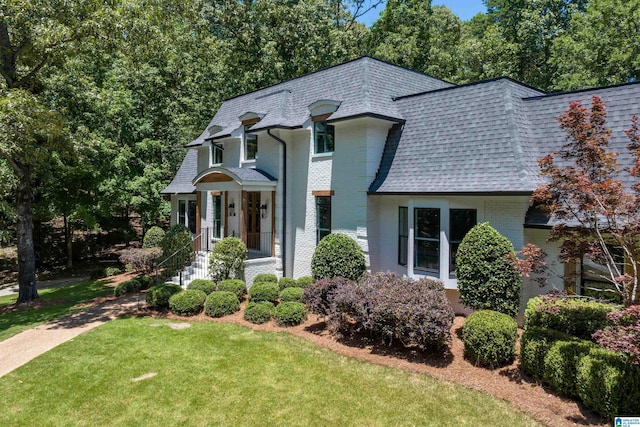 318 Valley View Rd, Indian Springs Village, AL 35124 - view of front of home featuring a shingled roof, mansard roof, brick siding, and a front lawn
