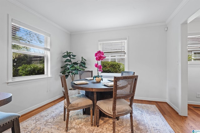 326 Lathrop Ave, Homewood, AL 35209 - dining space with crown molding and light wood-style floors
