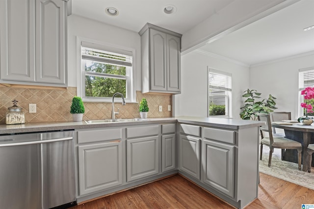326 Lathrop Ave, Homewood, AL 35209 - kitchen with stainless steel dishwasher, gray cabinets, healthy amount of natural light, light wood-type flooring, and ornamental molding