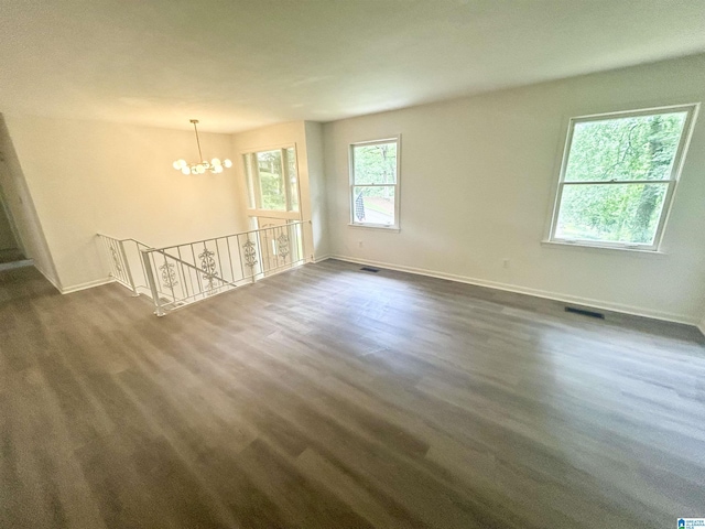 3583 Valley Cir, Vestavia Hills, AL 35243 - empty room with a chandelier and dark wood-style floors