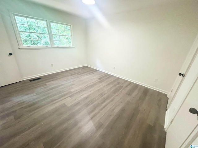 3583 Valley Cir, Vestavia Hills, AL 35243 - unfurnished bedroom featuring dark wood-type flooring and baseboards