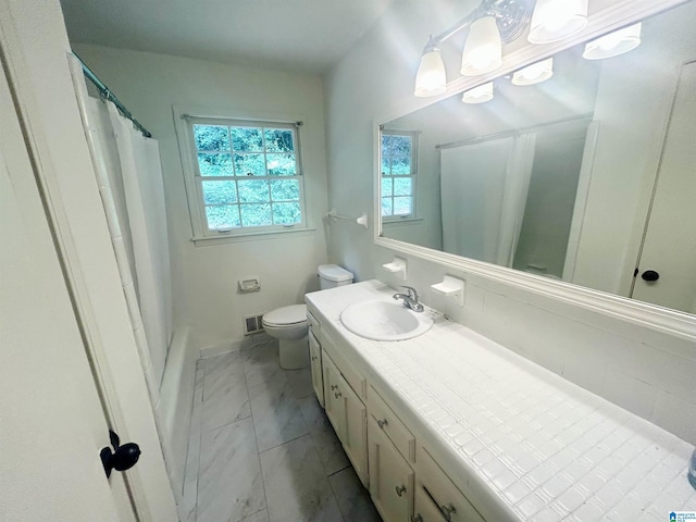 3583 Valley Cir, Vestavia Hills, AL 35243 - bathroom with marble look tile flooring, vanity, and shower / tub combo with curtain