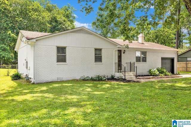 2009 Palmer Ave, Leeds, AL 35094 - ranch-style home with an attached garage, brick siding, a chimney, and roof with shingles