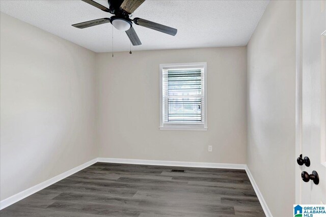 2009 Palmer Ave, Leeds, AL 35094 - unfurnished room featuring a ceiling fan, dark wood-type flooring, a textured ceiling, and baseboards