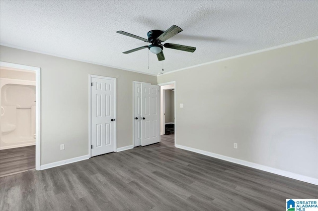 2009 Palmer Ave, Leeds, AL 35094 - unfurnished bedroom featuring wood finished floors, a textured ceiling, ensuite bathroom, baseboards, and crown molding