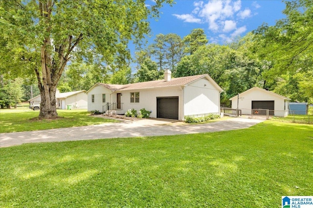2009 Palmer Ave, Leeds, AL 35094 - ranch-style house featuring a chimney and a detached garage
