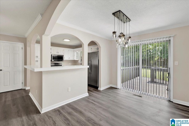 2009 Palmer Ave, Leeds, AL 35094 - kitchen with appliances with stainless steel finishes, dark wood finished floors, light countertops, white cabinets, and baseboards