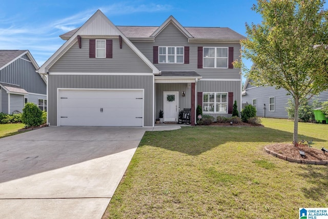 1515 Baxter Ave, Springville, AL 35146 - view of front of home featuring a front lawn, concrete driveway, an attached garage, board and batten siding, and a shingled roof