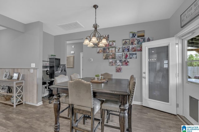 1515 Baxter Ave, Springville, AL 35146 - dining space with a chandelier, wood finished floors, and baseboards