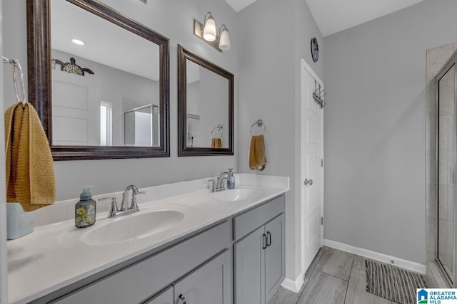 1515 Baxter Ave, Springville, AL 35146 - full bathroom featuring tiled shower, double vanity, and baseboards