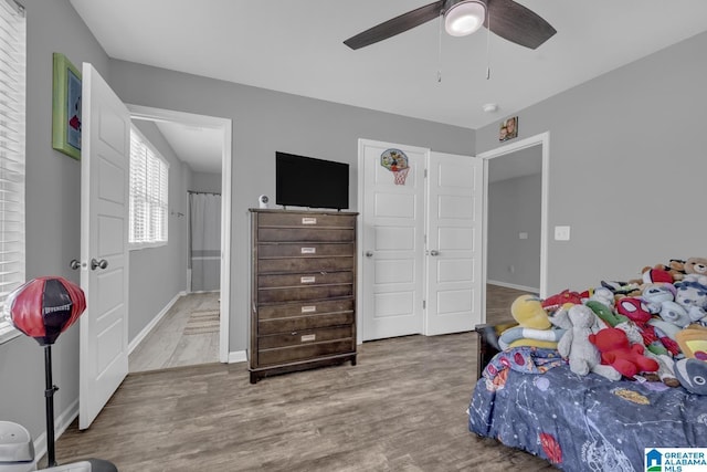 1515 Baxter Ave, Springville, AL 35146 - bedroom with wood finished floors, baseboards, and ceiling fan