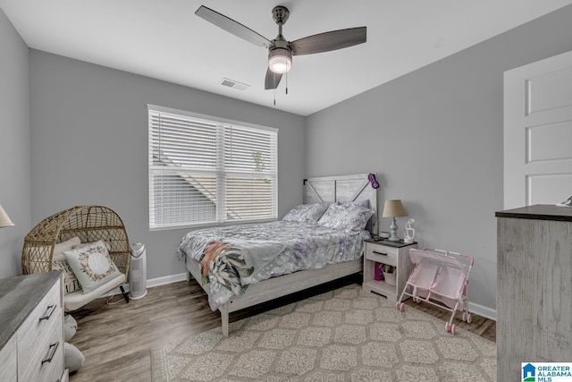1515 Baxter Ave, Springville, AL 35146 - bedroom featuring light wood-style flooring, baseboards, and a ceiling fan