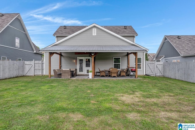 1515 Baxter Ave, Springville, AL 35146 - rear view of property with a gate, an outdoor living space, and a patio