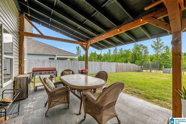 1515 Baxter Ave, Springville, AL 35146 - view of patio / terrace with a trampoline and outdoor dining area