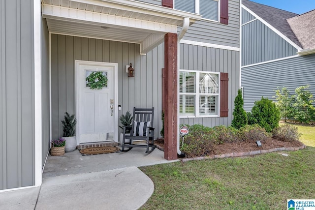 1515 Baxter Ave, Springville, AL 35146 - property entrance featuring roof with shingles, covered porch, and a lawn