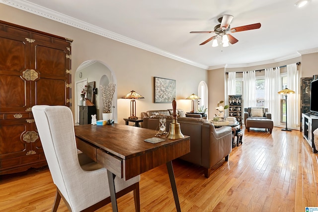 1963 Russet Hill Ln, Hoover, AL 35244 - living room with arched walkways, ceiling fan, light wood-type flooring, and crown molding