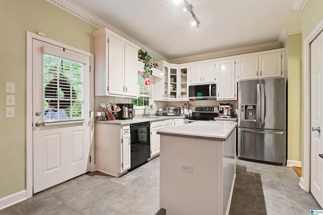 1963 Russet Hill Ln, Hoover, AL 35244 - kitchen featuring stainless steel appliances, plenty of natural light, white cabinetry, a kitchen island, and ornamental molding